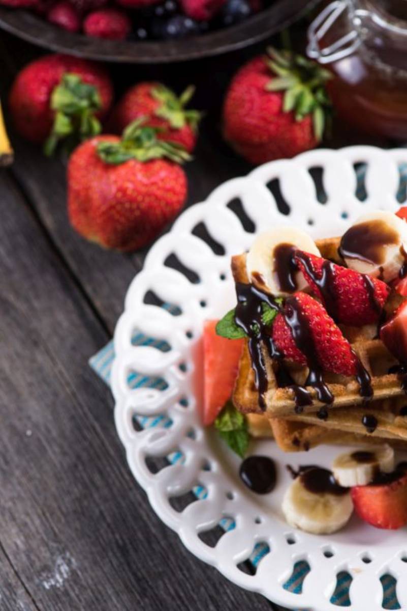 sweet waffles with fruits and chocolate